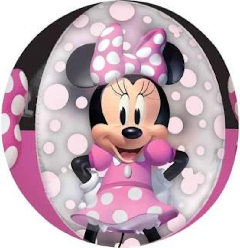 May include: A pink and white polka dot balloon with a cartoon image of Minnie Mouse. Minnie Mouse is wearing a pink dress with white polka dots and a white bow.
