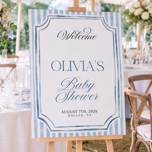 Editable blue striped baby shower welcome sign template with watercolor border, classic frame details, and elegant script lettering.