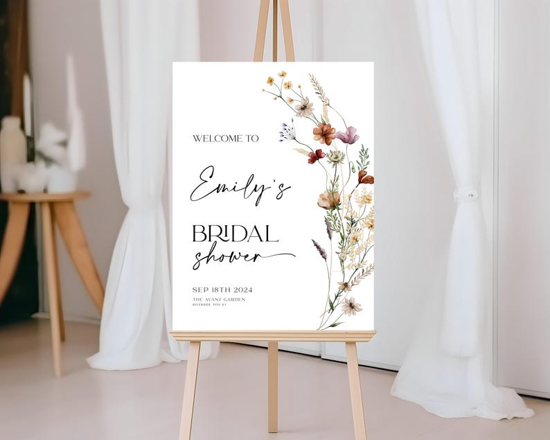 Bridal shower welcome sign template with boho watercolor wildflowers in warm earthy tones, featuring elegant mix of script and serif fonts on a clean white background, fully editable in Canva.