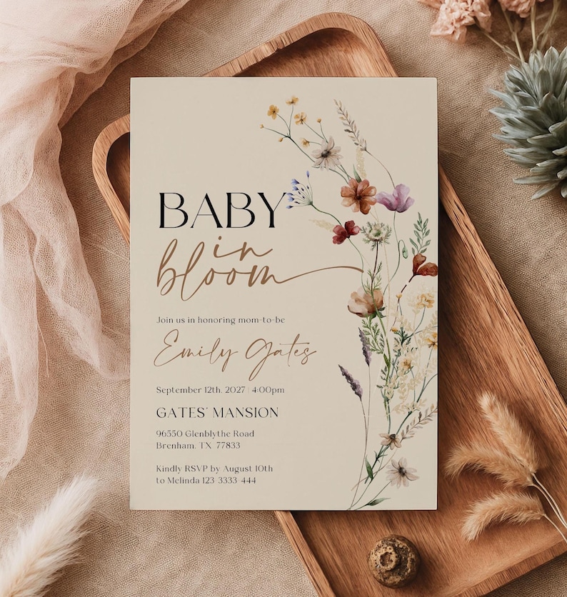 Editable Baby in Bloom baby shower invitation with watercolor wildflowers and boho floral design on a neutral background.