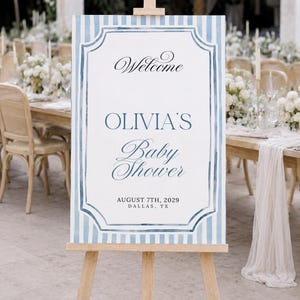 Editable blue striped baby shower welcome sign template with watercolor border, classic frame details, and elegant script lettering.