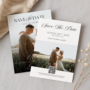 May include: Two wedding Save the Date cards with photos of a couple. The cards have the text "Save The Date" and the dates August 26, 2028 and August 26, 2027. The cards are on a neutral background.