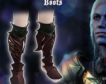Op de afbeelding: Een paar bruine en groene 3D-geprinte laarzen met een spinnenwebontwerp. De laarzen worden "Spidersilk Armour Boots" genoemd.