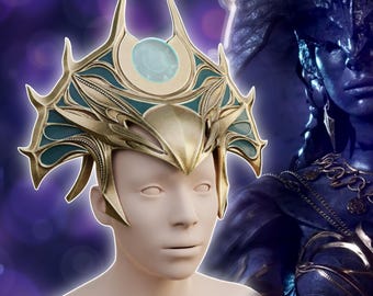 May include: A gold and teal crown with the text "Shar Crown" is displayed on a mannequin head. The crown features intricate details and a central blue gem. The image also includes the text "3D printer files Digital product".
