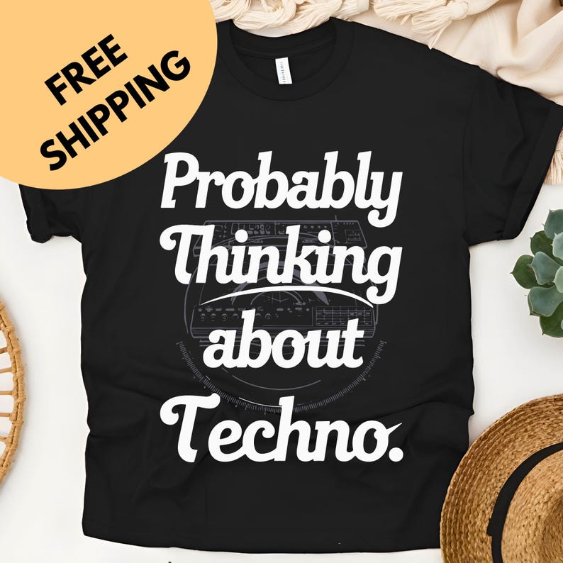 May include: Black t-shirt with the text "Probably Thinking about Techno" in white, along with a graphic of a soundboard. The shirt has a crew neck and short sleeves. A yellow circle with the words "FREE SHIPPING" is in the upper left corner.