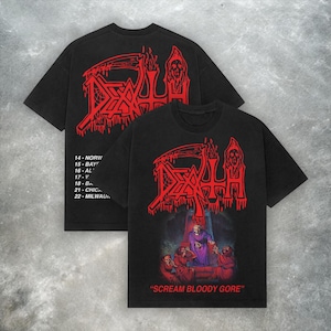 Puede incluir: Dos camisetas negras con diseños gráficos rojos. Una muestra la palabra "DEATH" con una parca y una calavera. La otra tiene el mismo diseño, más el texto "SCREAM BLOODY GORE" y una escena de cripta.
