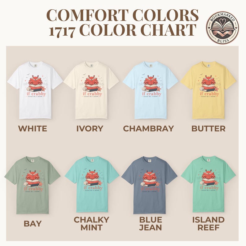 May include: A color chart of eight short-sleeve t-shirts in various colors, including white, ivory, chambray, and butter. Each shirt features a graphic of a crab on a stack of books with the text "if crabby". The text "COMFORT COLORS 1717 COLOR CHART" is at the top.