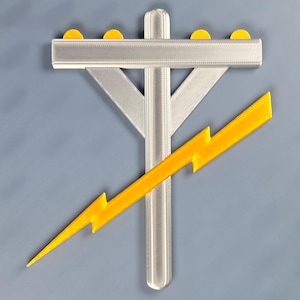 May include: A 3D-printed emblem featuring a utility pole with yellow accents and a yellow lightning bolt. The pole is silver and has four yellow circles on top. The lightning bolt is angled across the pole against a grey background.