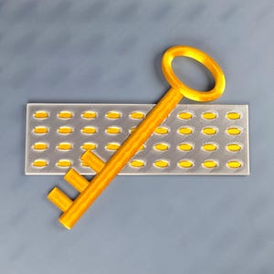 May include: A golden key rests diagonally across a rectangular, gray object with numerous yellow ovals. The key's handle is a simple loop, and the key's teeth are two short, parallel bars. The background is a solid, muted gray.