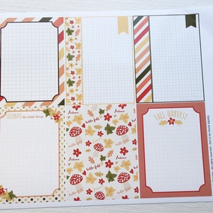 May include: A printed sheet with six rectangular designs, each with a grid pattern. The designs feature autumn-themed borders with fall colors, leaves, and the phrases "Celebrate the little things" and "Fall Harvest."