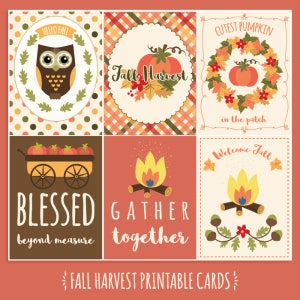 May include: A collection of six fall-themed printable cards. The cards feature illustrations of an owl, pumpkins, a wagon of apples, a campfire, and fall foliage. Text includes "Hello Fall," "Fall Harvest," "Cutest Pumpkin," "Blessed beyond measure," "Gather together," and "Welcome Fall."