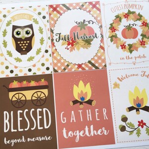 May include: A sheet of fall-themed cards with various designs. One card features an owl, another a pumpkin, and others include text like "Blessed" and "Gather Together." The color palette includes orange, brown, and yellow.