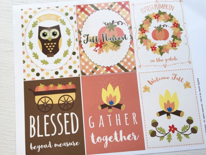 May include: A sheet of fall-themed cards with various designs. One card features an owl, another a pumpkin, and others include text like "Blessed" and "Gather Together." The color palette includes orange, brown, and yellow.