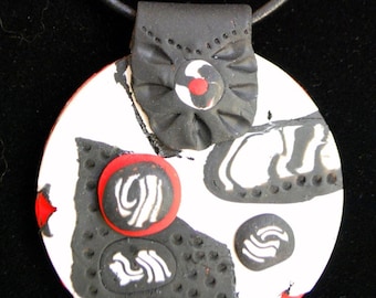 Handmade, hand carved clay pendant necklace and earring set by Designer Susan W. Showalter. Arrives in an elegant black velvet bag.