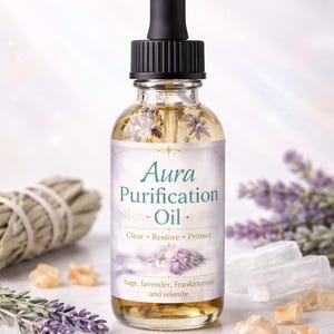 May include: Aura Purification Oil in a clear glass bottle with a black dropper. The label reads "Aura Purification Oil" with the words "Clear, Restore, Protect". Sage, lavender, frankincense, and selenite are also pictured.