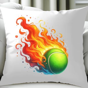 May include: A white pillow with a green tennis ball engulfed in orange and yellow flames. The flames are stylized and have a blue hue at the bottom.