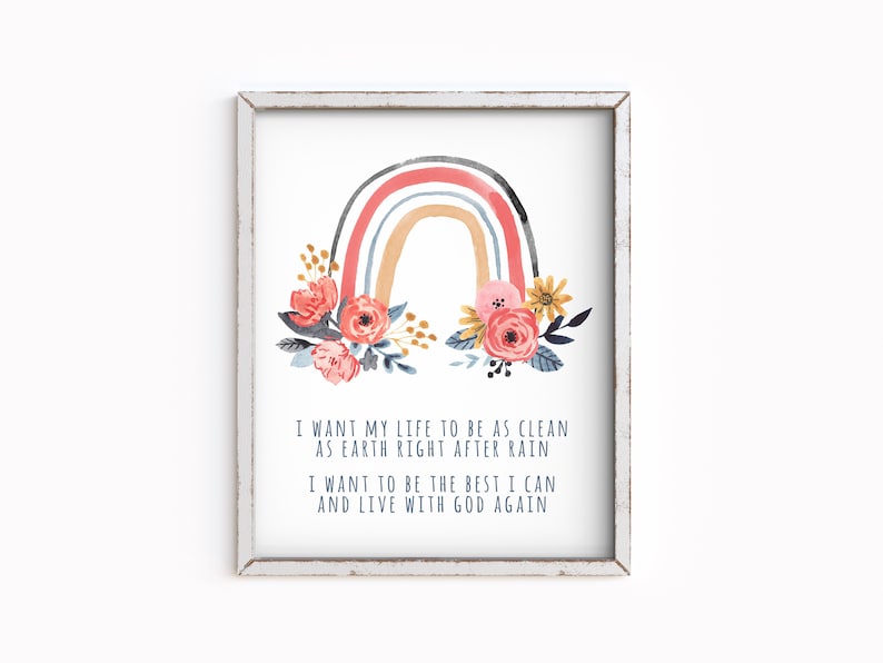 May include: A watercolor rainbow with pink, orange, blue, and gray stripes, surrounded by pink, yellow, and blue flowers. The text below reads: "I want my life to be as clean as earth right after rain. I want to be the best I can and live with God again."