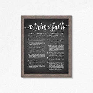 May include: A black chalkboard with a white frame displays the Articles of Faith of The Church of Jesus Christ of Latter-day Saints. The text is written in a decorative script font.
