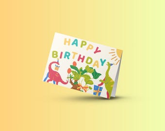 May include: A white card with the words "Happy Birthday" in colorful letters. The card features a cartoon illustration of two dinosaurs, a plant, and a gift box.