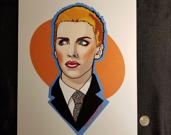 May include: A digital illustration of a person with short, blonde hair wearing a black suit with a patterned tie. The person is looking to the right and has a serious expression. The background is a solid orange color.