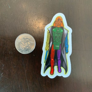 May include: A colorful sticker of Darth Vader from Star Wars. The sticker is on a white background and features a rainbow color scheme. The character is depicted in a black cape and holding a lightsaber.