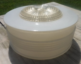 May include: White frosted glass ceiling light fixture with a clear glass dome diffuser. The diffuser has a ribbed pattern.