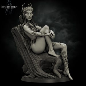 May include: A grayscale figurine of a seated woman with long hair, a crown, and leaf-like adornments. She is seated on a tree stump, with vines wrapping around her legs and arms. The Stormborn Collectibles logo is in the upper left corner.