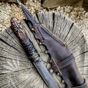 Hand-Forged Viking Seax Knife with Authentic Runes. Viking warrior  statue hand-carved hardwood handle - Custom Leather Sheath.