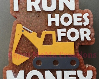 May include: A yellow excavator with black tracks is on a brown background with the text "I run hoes for money" in white letters.
