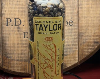 Custom made Bourbon E H Taylor bottle lamp with tube & shiny pebbles. Shade and base not included.