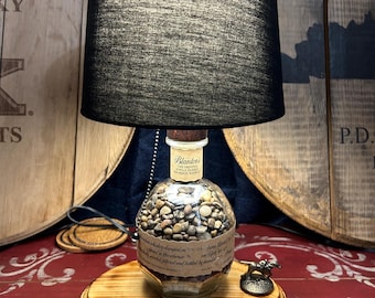 Custom made Bourbon Blantons The Original Single Barrel lamp with pebbles. Shade not included.