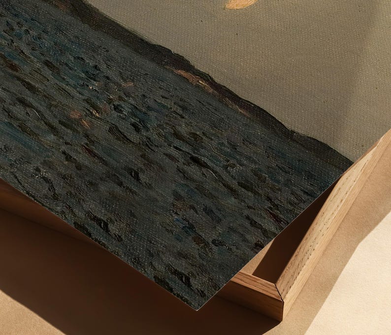 May include: An oil painting depicting a seascape with dark blue water and a muted gray sky. The artwork is framed in a natural wood frame, with the canvas slightly angled, revealing the texture of the paint.