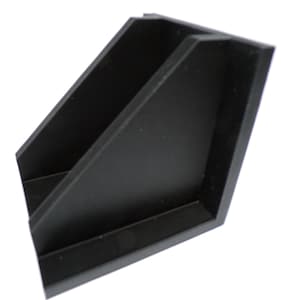May include: A black plastic desk organizer with two angled compartments. The organizer has a simple, geometric design and is set against a white background. The item is designed to hold office supplies.