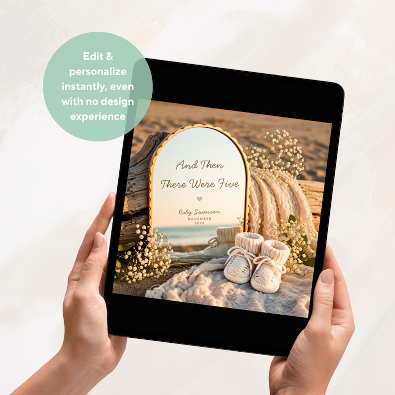 May include: A digital tablet displaying an arched mirror with the text And Then There Were Five, Baby Swanson, and November 2020. The mirror reflects a beach scene with baby booties and white flowers placed on a textured fabric in the foreground.