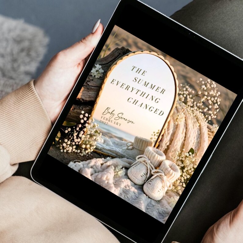 May include: A digital tablet displaying a graphic with an arched gold-rimmed mirror reflecting a beach scene. The text reads THE SUMMER EVERYTHING CHANGED, Baby Swanson, and FEBRUARY 2027. In the foreground are cream-colored knit baby booties.
