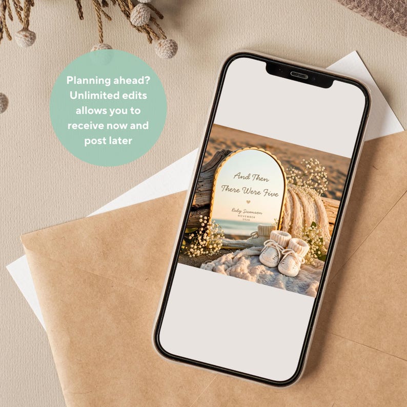 May include: A smartphone displaying a digital announcement card with the text And Then There Were Five, Baby Swanson, November 2025. The card features an arched mirror reflecting a beach scene, paired with small white baby booties and dried flowers.