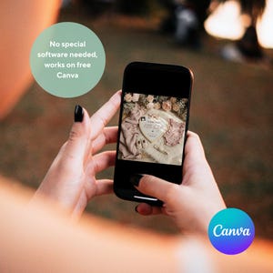May include: A smartphone displays a baby announcement design. The design includes a heart-shaped frame with the words "little baby", baby shoes, and a onesie. The image is surrounded by flowers and soft fabrics. The Canva logo is visible.