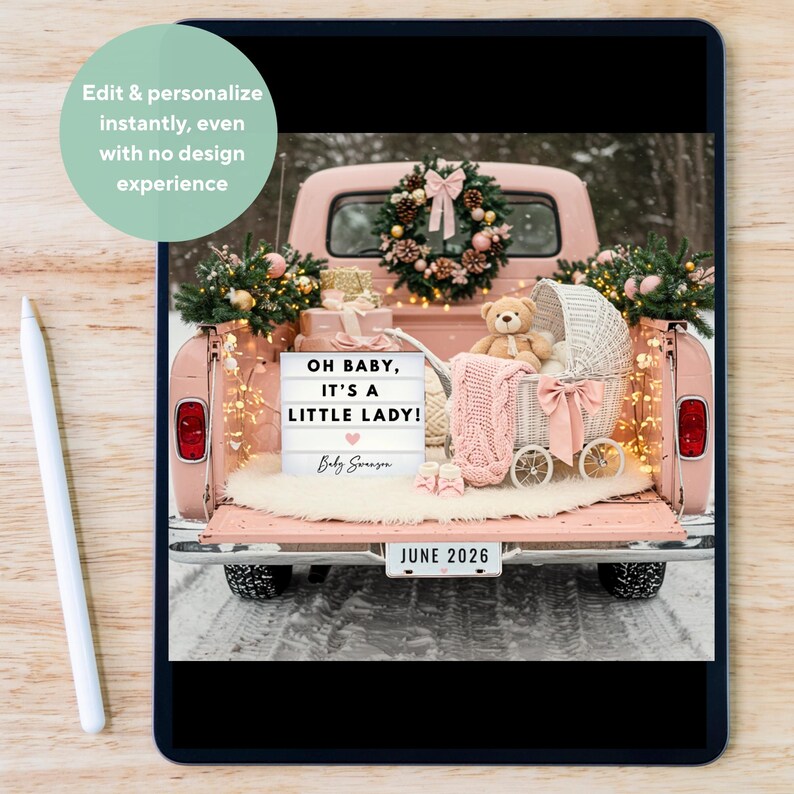 May include: A pink vintage truck bed is decorated for a baby announcement. It features a light-up sign that reads "OH BABY, IT'S A LITTLE LADY!" with a heart, a teddy bear, a baby carriage, and a knitted blanket. The license plate reads "JUNE 2026".