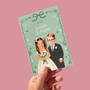 May include: A mint green wedding invitation with a vintage illustration of a young couple. The invitation is decorated with floral and heart motifs, with the names "James & Katie" and the date "26.08.26" printed on the front.