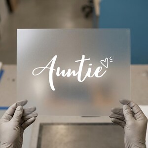 May include: A handmade wooden sign with the text "Welcome" in a playful font. The sign features a distressed finish and a simple, rustic design, perfect for a front door or entryway.