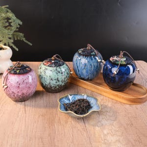 May include: A rustic wooden sign with the text "Welcome to our home" in white lettering. The sign features a distressed finish and a simple, inviting design, perfect for front door decor.