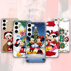 May include: A collection of five phone cases featuring festive Christmas designs. Each case showcases a different holiday-themed illustration of Mickey and Minnie Mouse, with vibrant colors and detailed artwork. The cases are designed for a smartphone.