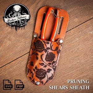 May include: A brown leather pruning shears sheath with a floral design. The sheath has a belt loop and a snap closure. The shears are orange and have a metal handle.