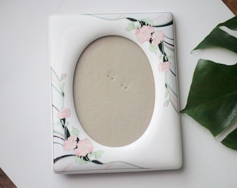 vintage / ceramic beveled edge photo frame with floral motif