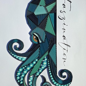 May include: A paper quilling art piece depicting an octopus in shades of teal, dark blue, and green. The octopus features geometric patterns and a single brown eye. The word Faszination is written in black cursive script to the right of the octopus.