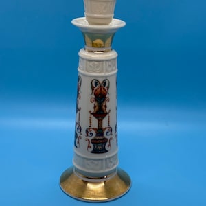 May include: A set of three ceramic mugs with a speckled, matte finish. The mugs are in shades of cream, light gray, and dark gray. Each mug has a simple, minimalist design and a rounded handle.