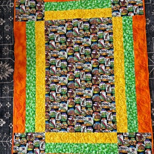 Handmade cotton throw quilt jar of insects central panel bold, orange, yellow, and green birders. A bug lovers dream 38 X 51 inches