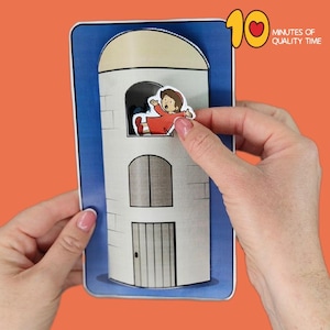 May include: A pop-up paper craft featuring a white tower with a beige dome and blue border. A small figure in a red outfit is being placed in a window. The text "10 Minutes of Quality Time" is in the upper right corner.