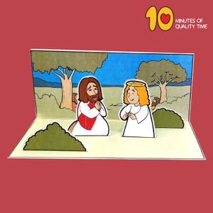 Könnte beinhalten: Eine Pop-up-Karte, die eine Szene aus der Bibel darstellt. Jesus kniet mit gefalteten Händen im Gebet. Ein Engel mit einem Heiligenschein steht hinter ihm mit gefalteten Händen vor sich. Die Szene spielt in einem Garten mit Bäumen und Büschen.