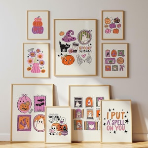 May include: A collection of framed Halloween-themed art prints. The prints feature illustrations of pumpkins, ghosts, witch hats, and the text "Spooky Season", "Boo(k) Club", and "I Put a Spell on You". The color palette includes orange, purple, and black.